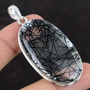 Quartz With Black Rutile Set In Silver Pendant.